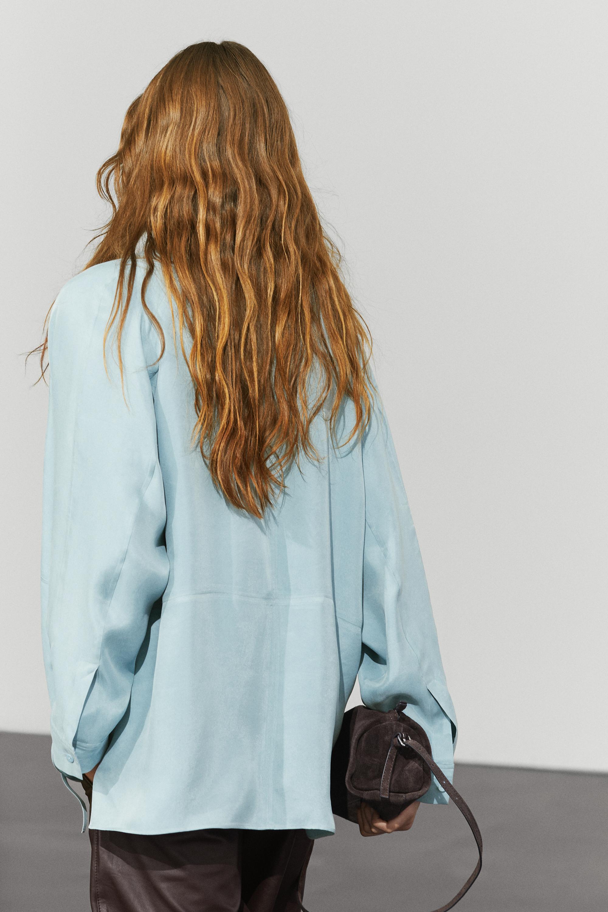 Flowing shirt with high collar and drawstring detail